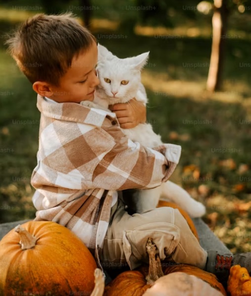 Boy hugging cat.jpg